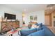 Cozy living room featuring a modern console, wall-mounted TV, and comfortable seating perfect for relaxation at 146 Oakchase Park Ln, Hampton, GA 30228