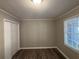 Bright bedroom with wood-look floors and ample closet space at 2028 Wells Sw Dr, Atlanta, GA 30311