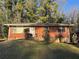 Brick ranch house with a grassy yard at 2028 Wells Sw Dr, Atlanta, GA 30311