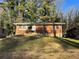 Brick ranch house with a well-manicured lawn at 2028 Wells Sw Dr, Atlanta, GA 30311