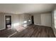 Sunlit living room with hardwood floors and neutral walls at 2028 Wells Sw Dr, Atlanta, GA 30311