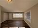 Bright living room with hardwood floors and lots of windows at 2028 Wells Sw Dr, Atlanta, GA 30311