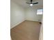 Bright bedroom with ceiling fan and light wood flooring at 2662 Sweetwater St, Austell, GA 30106