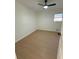 Spacious bedroom with light wood flooring and ceiling fan at 2662 Sweetwater St, Austell, GA 30106