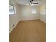 Well-lit bedroom, featuring light wood flooring and ceiling fan at 2662 Sweetwater St, Austell, GA 30106