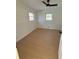 Spacious bedroom with ceiling fan and light wood flooring at 2662 Sweetwater St, Austell, GA 30106