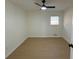 Spacious bedroom with light wood flooring and ceiling fan at 2662 Sweetwater St, Austell, GA 30106