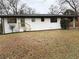 Charming ranch home with white brick exterior and landscaped yard at 2662 Sweetwater St, Austell, GA 30106