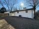 Rear view of house showing new AC unit and landscaping at 2662 Sweetwater St, Austell, GA 30106