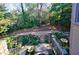 Landscaped backyard with steps leading up to deck at 2853 N Hills Ne Dr, Atlanta, GA 30305