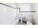 Clean bathroom with black and white tile and pedestal sink at 2853 N Hills Ne Dr, Atlanta, GA 30305