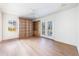 Hardwood floor bedroom with built-in shelves and access to deck at 2853 N Hills Ne Dr, Atlanta, GA 30305