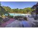 Community pool with surrounding trees and picnic tables at 2853 N Hills Ne Dr, Atlanta, GA 30305