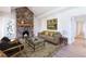 Spacious living room featuring a stone fireplace and hardwood floors at 2853 N Hills Ne Dr, Atlanta, GA 30305