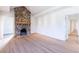 Bright living room with hardwood floors and stone fireplace at 2853 N Hills Ne Dr, Atlanta, GA 30305