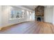 Bright living room with hardwood floors and stone fireplace at 2853 N Hills Ne Dr, Atlanta, GA 30305