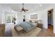 Main bedroom with hardwood floors, large windows and ceiling fan at 2853 N Hills Ne Dr, Atlanta, GA 30305