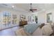 Main bedroom with hardwood floors, large windows and ceiling fan at 2853 N Hills Ne Dr, Atlanta, GA 30305