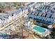 A beautiful aerial view of townhomes featuring a pool and well-manicured landscaping at 324 Concord St, Alpharetta, GA 30009