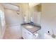 This neutral bathroom has a quartz countertop vanity and is connected to a bedroom at 324 Concord St, Alpharetta, GA 30009