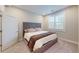 Comfortable bedroom with a plush bed, patterned throw blanket, and a window with shutter blinds at 324 Concord St, Alpharetta, GA 30009