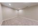 The empty bedroom provides a blank canvas with neutral walls and plush carpeting at 324 Concord St, Alpharetta, GA 30009