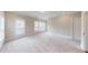 Bright bedroom with neutral carpet, plantation shutters, and ample natural light at 324 Concord St, Alpharetta, GA 30009