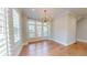 Bright dining area with hardwood floors, decorative light fixture, and natural light at 324 Concord St, Alpharetta, GA 30009