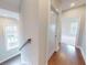 Hallway with hardwood floors, natural light from the windows, and entry to the bedroom at 324 Concord St, Alpharetta, GA 30009