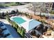 Overhead shot of the neighborhood pool with a gazebo, elegant landscaping, and stone retaining wall at 324 Concord St, Alpharetta, GA 30009