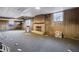 Unfinished basement with brick fireplace and wood paneling at 1892 Mercedes Ne Ct, Atlanta, GA 30345