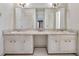 Bathroom with double vanity, marble countertop and vintage details at 1892 Mercedes Ne Ct, Atlanta, GA 30345