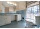 Bathroom with light blue tile, a vanity, and large window at 1892 Mercedes Ne Ct, Atlanta, GA 30345