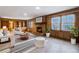 Gathering room features wood paneling, fireplace, and built-in shelving at 1892 Mercedes Ne Ct, Atlanta, GA 30345