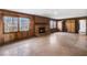 Bright Gathering room with wood paneling, fireplace, and built-ins at 1892 Mercedes Ne Ct, Atlanta, GA 30345