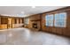 Gathering room with wood paneling, fireplace, and ample space at 1892 Mercedes Ne Ct, Atlanta, GA 30345