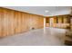 Spacious Gathering room with wood paneling and built-in shelving at 1892 Mercedes Ne Ct, Atlanta, GA 30345