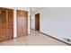 Long hallway with wood doors and closet space at 1892 Mercedes Ne Ct, Atlanta, GA 30345