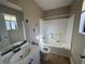 Bathroom includes a bathtub, toilet, and vanity with sink at 3959 Wood Path Dr, Stone Mountain, GA 30083