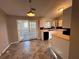 Kitchen features white cabinets, tile floors, and French doors at 3959 Wood Path Dr, Stone Mountain, GA 30083