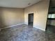 Spacious living room with tile flooring and access to kitchen and stairs at 3959 Wood Path Dr, Stone Mountain, GA 30083