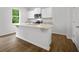 Kitchen island with granite countertop and sink at 101 Hill Side Ln, Dallas, GA 30157