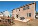 Brick home backyard features a patio with a table and barbecue grill, ideal for outdoor entertaining at 200 Claret Way, Mcdonough, GA 30252