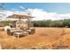 Spacious backyard with outdoor seating and a view of the home, perfect for relaxation and enjoying the outdoors at 200 Claret Way, Mcdonough, GA 30252