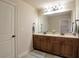 Bathroom with double sink vanity, great lighting, and a tiled floor at 200 Claret Way, Mcdonough, GA 30252