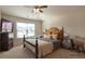 Comfortable bedroom with lots of natural light and a decorative ceiling fan at 200 Claret Way, Mcdonough, GA 30252
