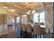 Formal dining room with coffered ceiling, large table, and ample seating for entertaining at 200 Claret Way, Mcdonough, GA 30252