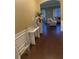 Inviting entryway featuring hardwood floors, elegant decor, and an open view into the living area at 200 Claret Way, Mcdonough, GA 30252
