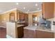Eat-in kitchen with stainless appliances, granite countertops and archways to other rooms at 200 Claret Way, Mcdonough, GA 30252