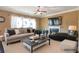 Cozy living room featuring a fireplace, comfortable seating, and a virtual staging design at 200 Claret Way, Mcdonough, GA 30252